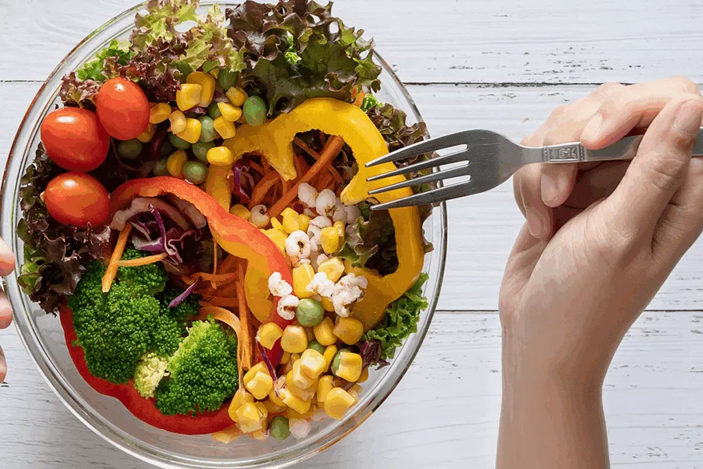Assorted fresh vegetables on a wooden surface